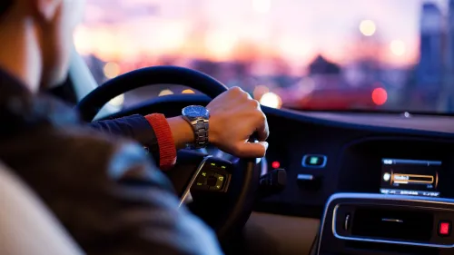 A person driving a vehicle