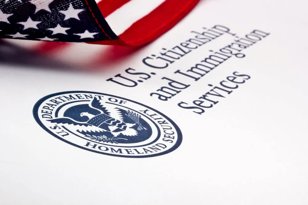 U.S. Citizenship and Immigration Services (USCIS) logo with U.S. flag